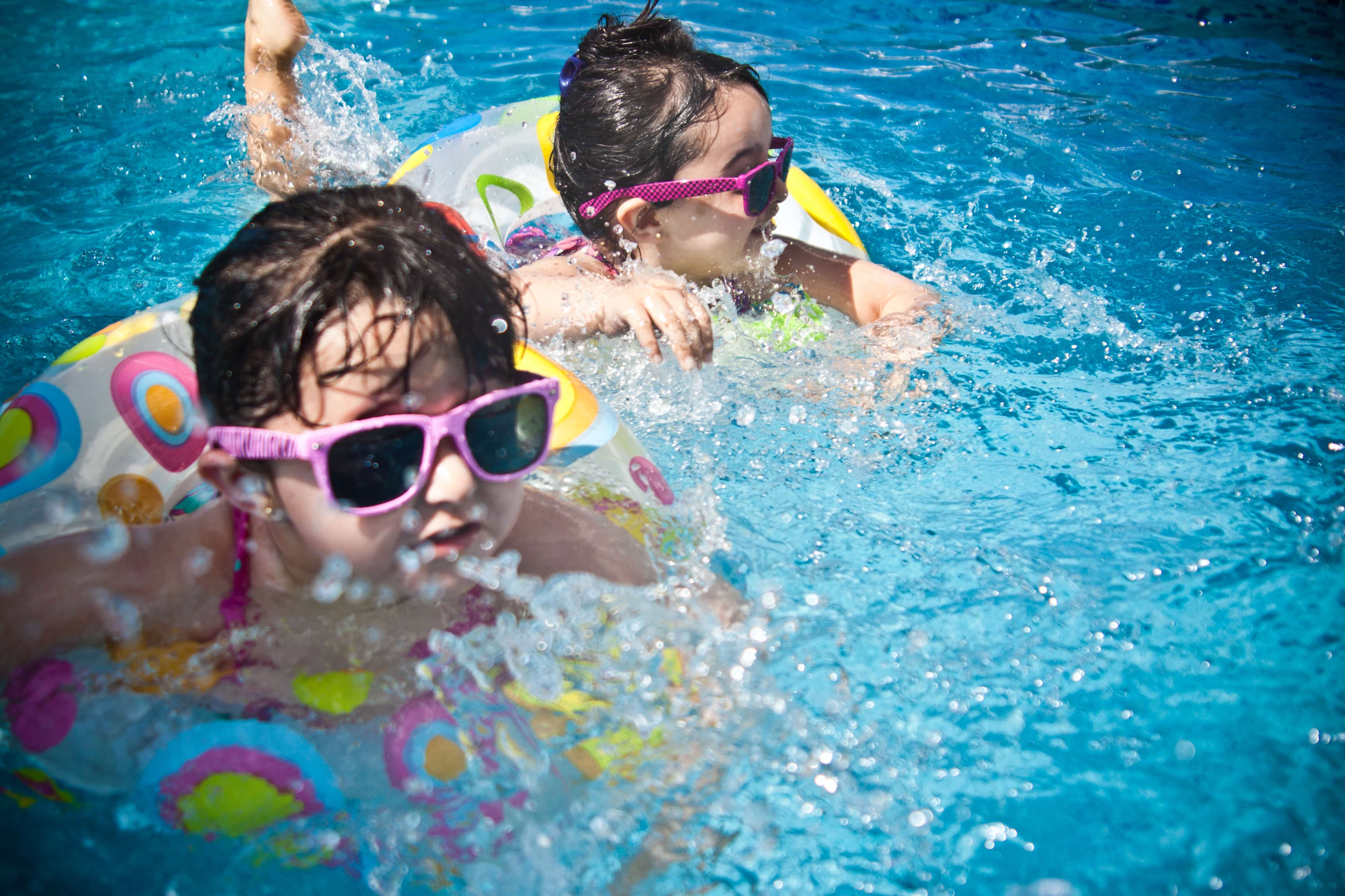 boy-girl-child-swimming-with-goggles-pool.jpg