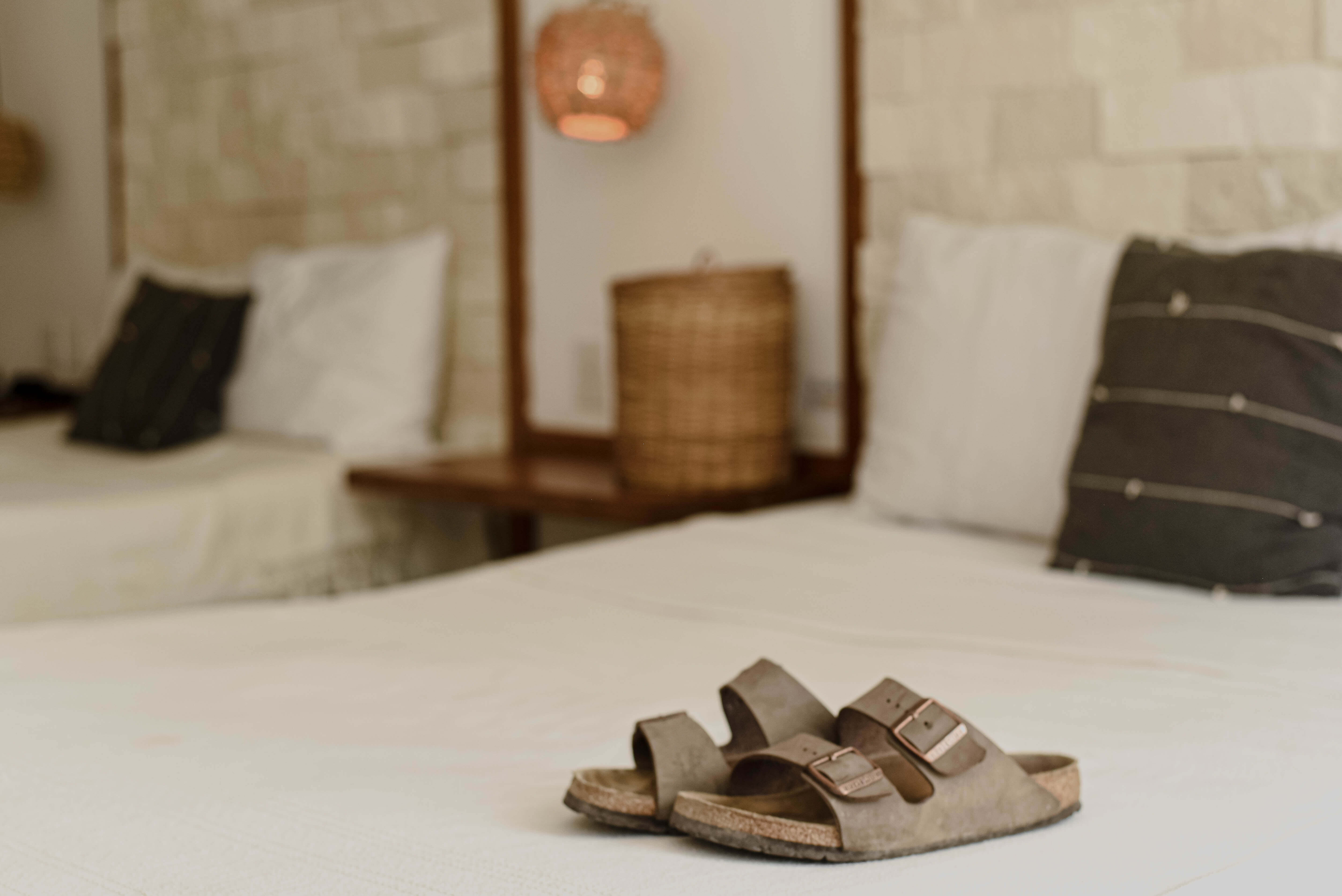 birkenstock-sandals-laid-on-bed.jpg