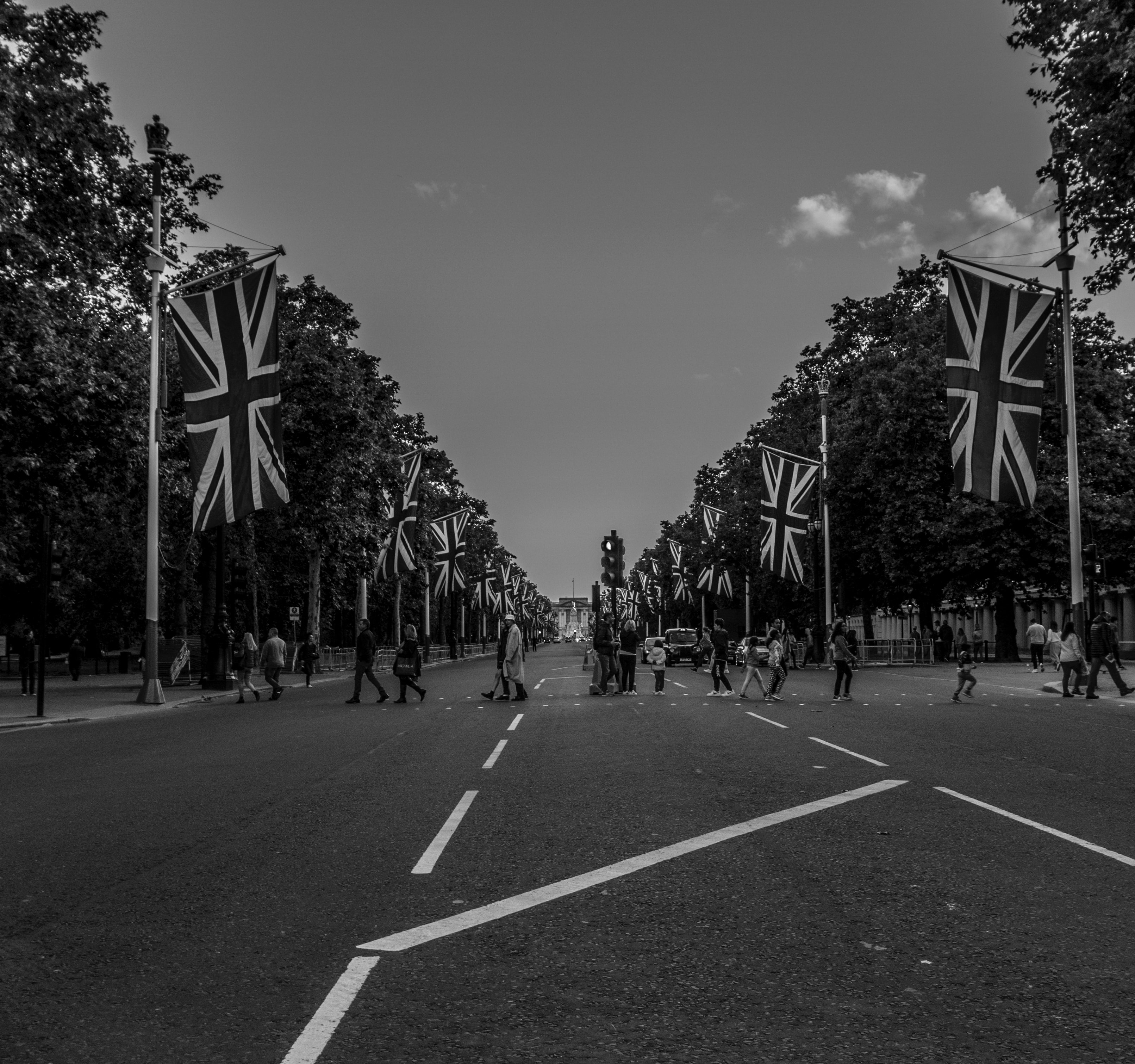 people-walking-down-road-union-jack-flags.jpg