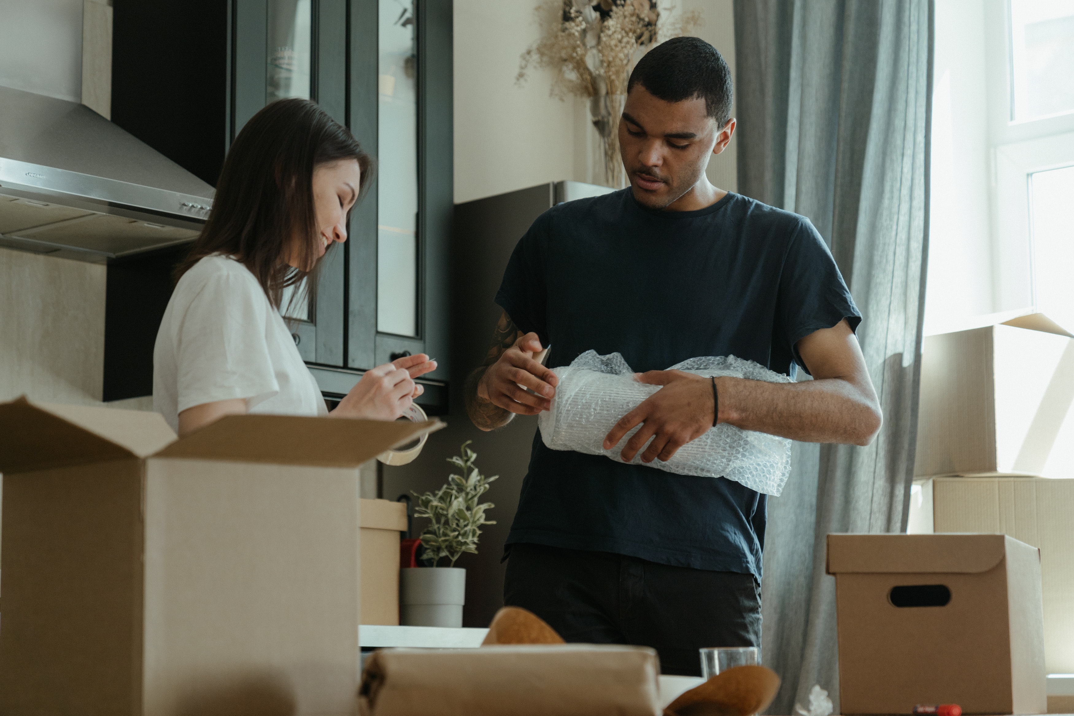couple-packing-boxes-moving-house.jpg