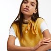 Maglione lungo senza maniche da donna