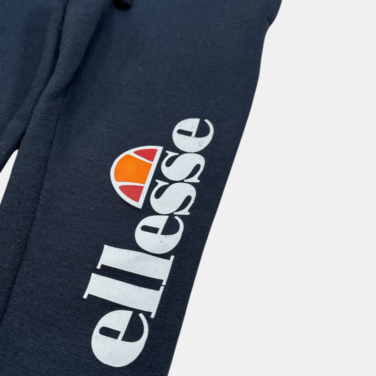 Ensemble 3 pièces doudoune sans manches, t-shirt et pantalon de jogging SQUAD bleu marine, ELLESSE