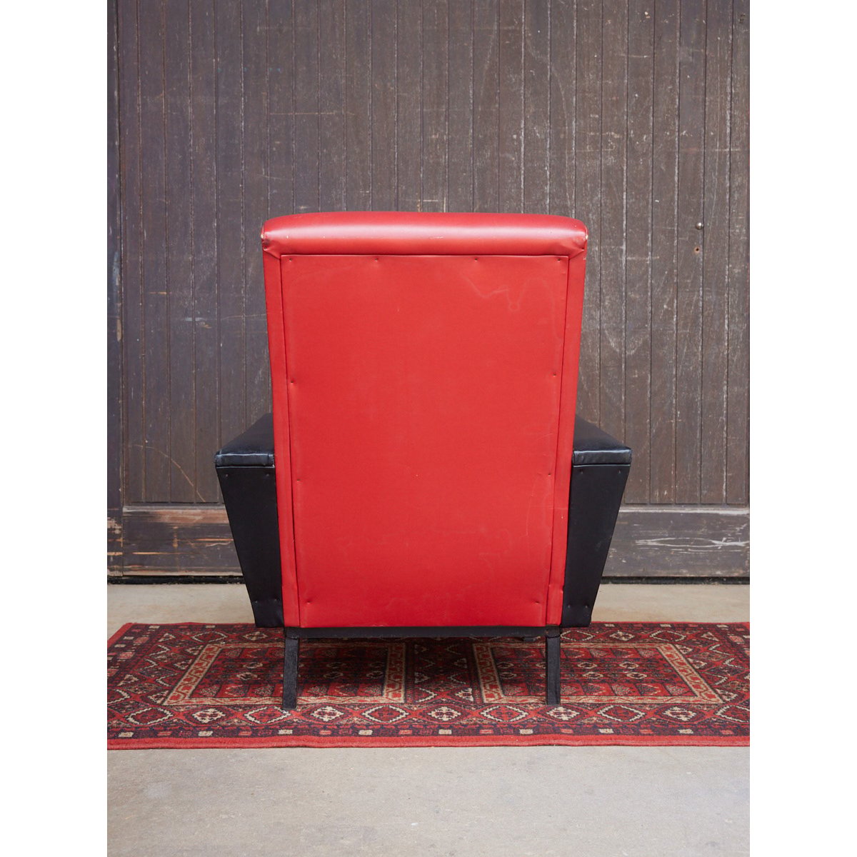 Fauteuil vintage en skai bicolore Jakob N°1285 - Bon état rouge, DEBONGOUT