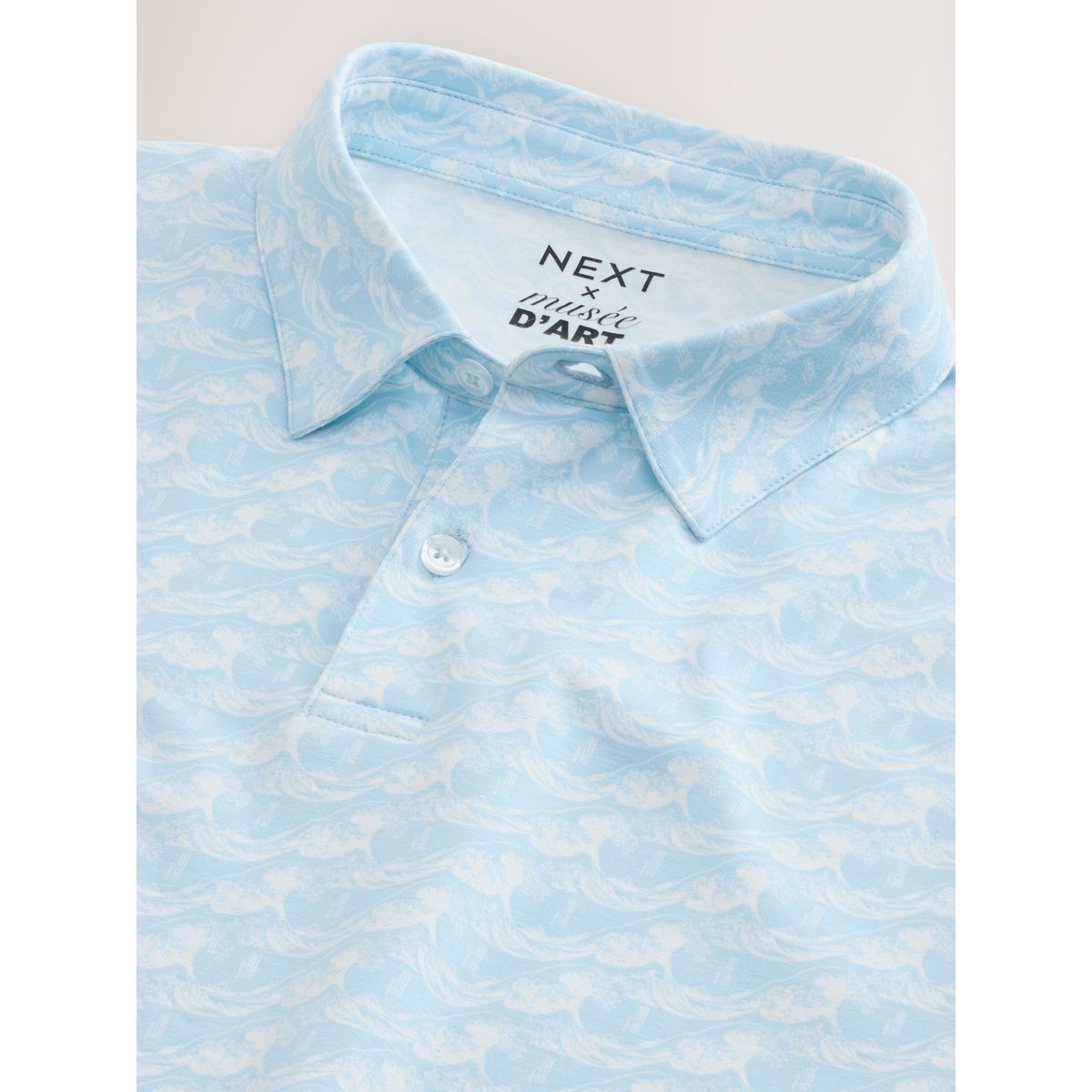Polo manches courtes à col boutonné et motif vague hokusai bleue, NEXT