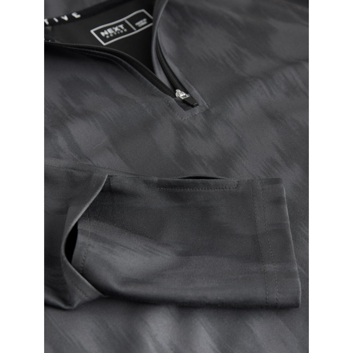 Haut de course à fermeture semi-zippée active noir/blanc, NEXT