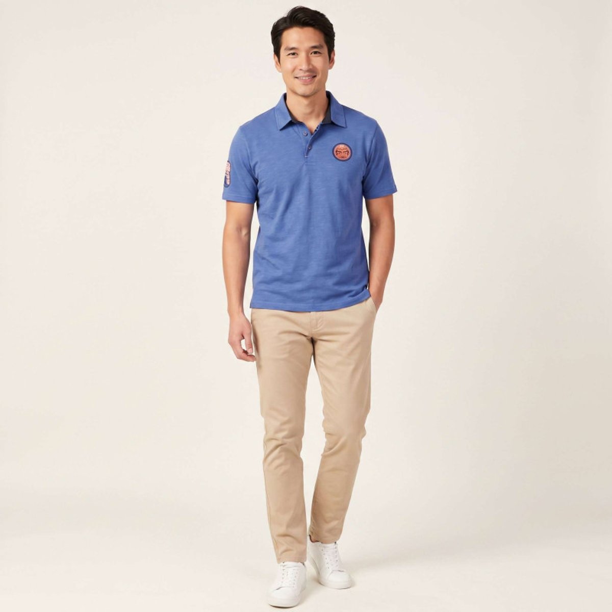 Polo en coton biologique bleu uni pourvu d'une coupe droite et d'un col boutonné bleu, RUCKFIELD