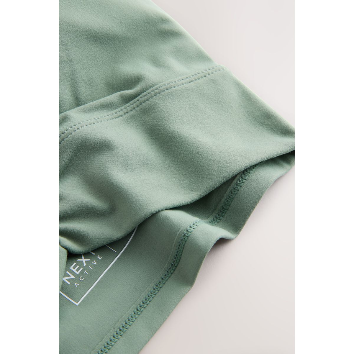 Brassière de sport à dos torsadé active vert sauge, NEXT