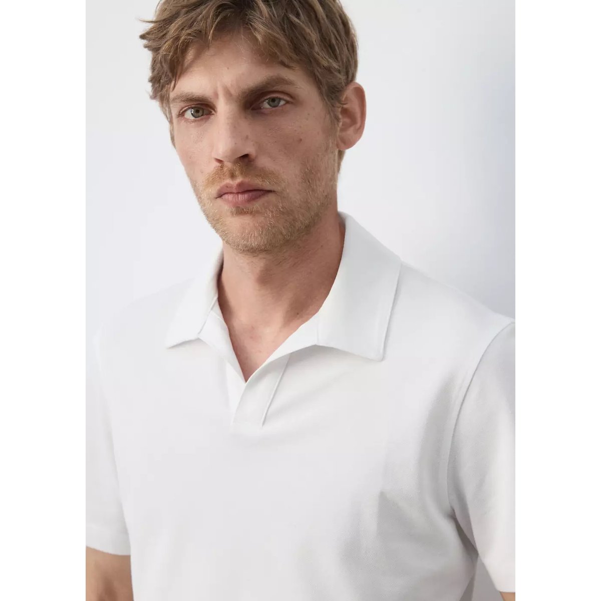 Polo slim fit en piqué de coton mélangé blanc, MANGO MAN