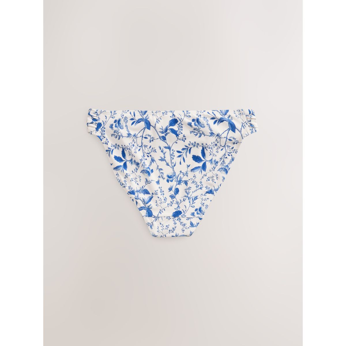 Bas de bikini échancré avec côtés froncés crème/bleu à petits motifs floraux, NEXT