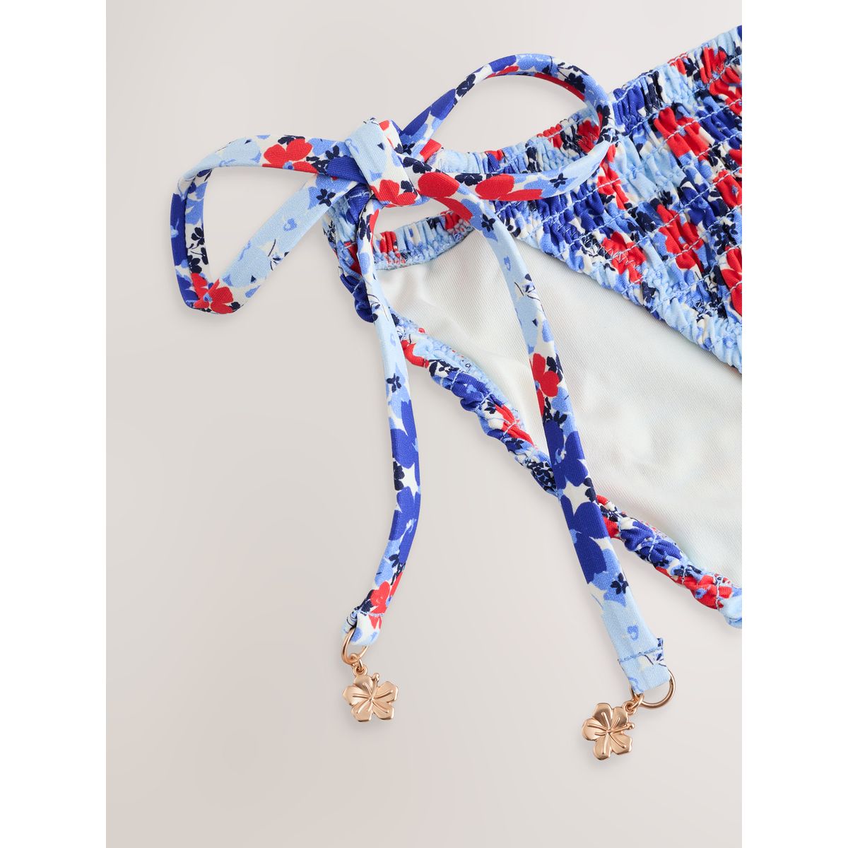 Bas de bikini froncé à nouer sur les côtés bleu/rouge à petites fleurs, NEXT