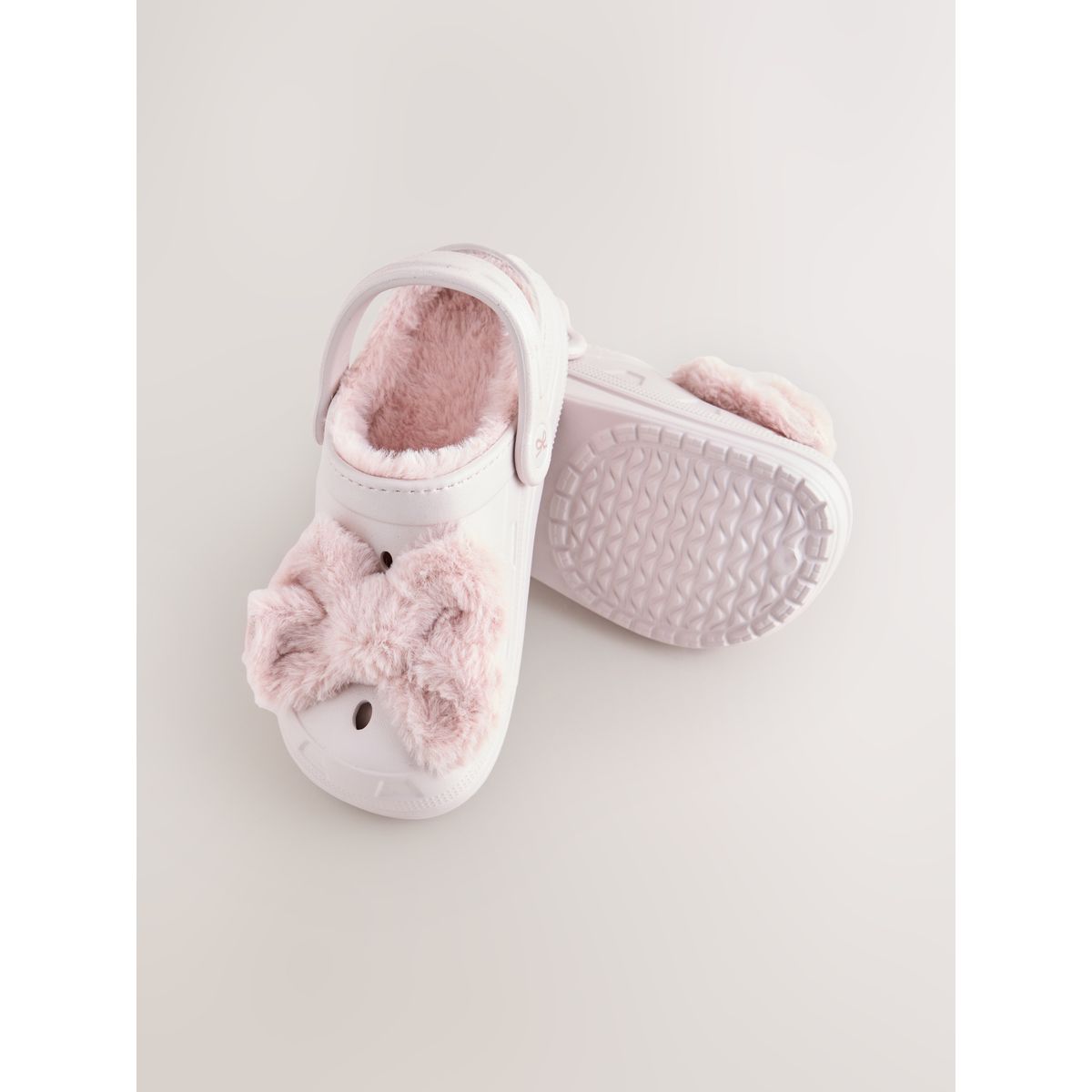 Chaussons style sabots doublés d'imitation fourrure noeud rose, NEXT