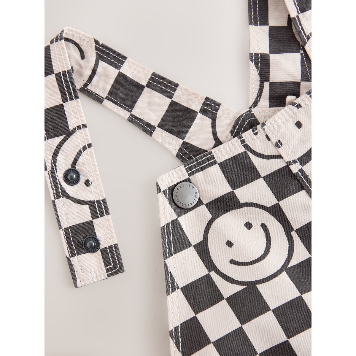 Salopette damier visage souriant noir/neutre, NEXT