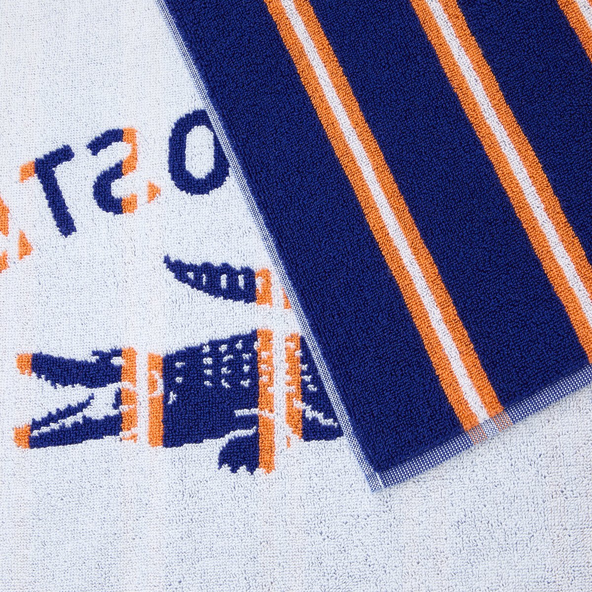 Serviette de plage en coton, L SUNSTRIPE saphir, LACOSTE HOME