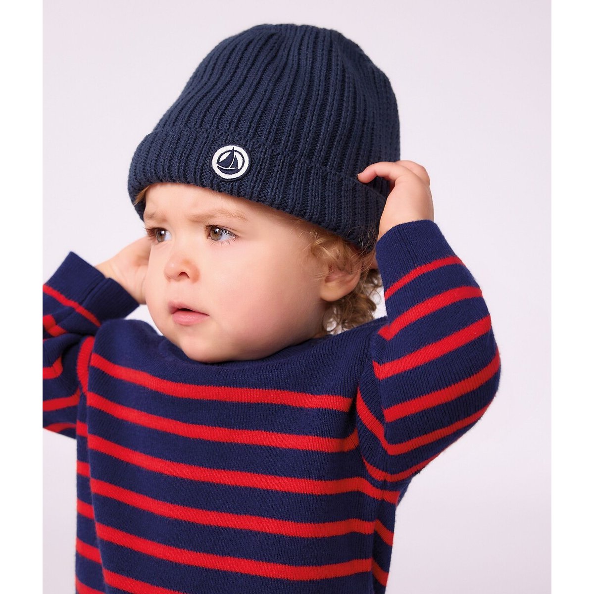 Bonnet bébé uni en tricot doublé polaire bleu marine, PETIT BATEAU