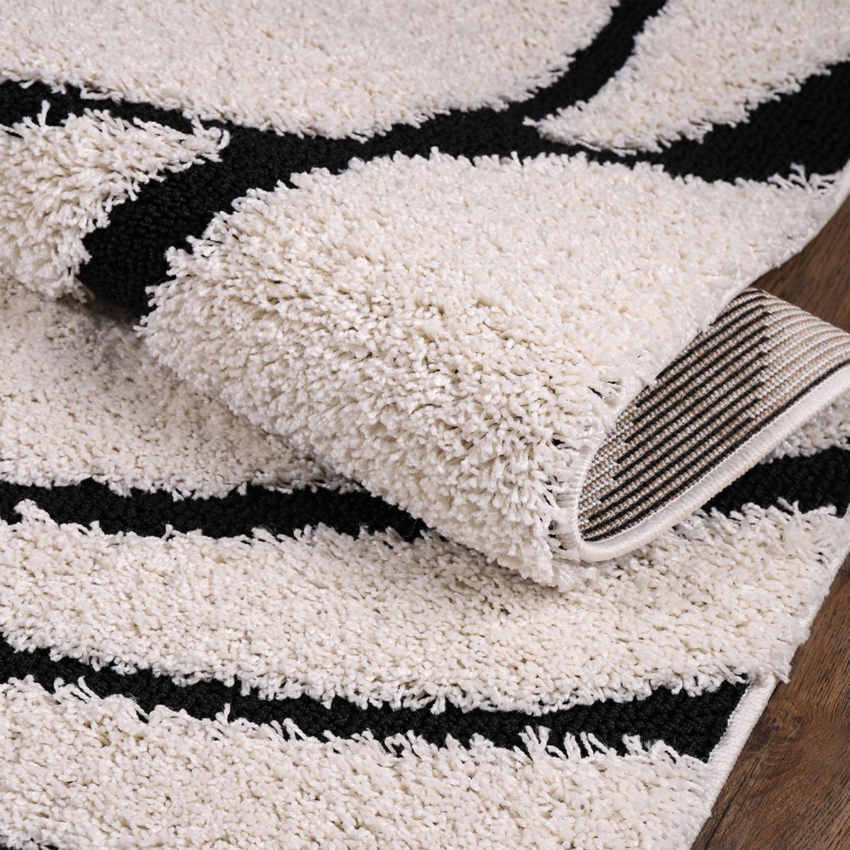 Tapis rond shaggy tissé motif géométrique POUDA crème, noir, UN AMOUR DE TAPIS