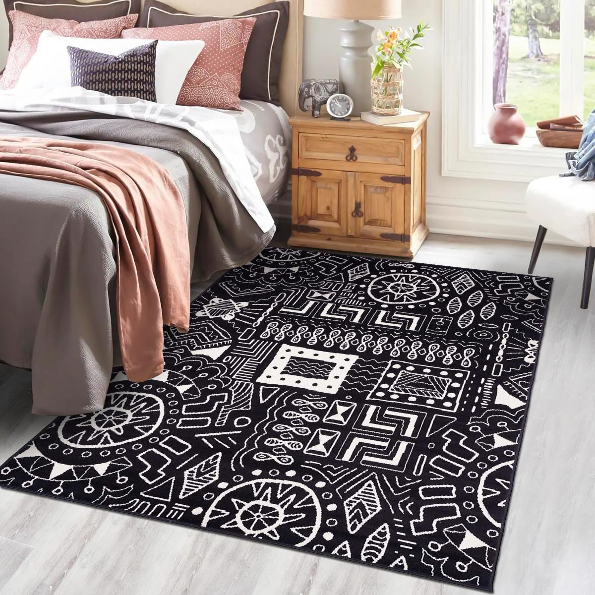 Tapis chambre tissé motif ethnique LYN1 MOTIF noir, UN AMOUR DE TAPIS