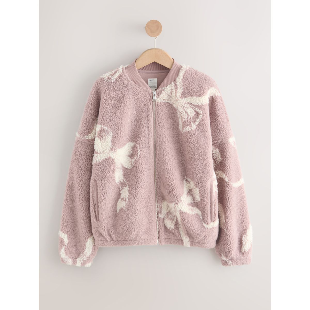 Veste polaire zippée en peau lainée noeud rose, NEXT