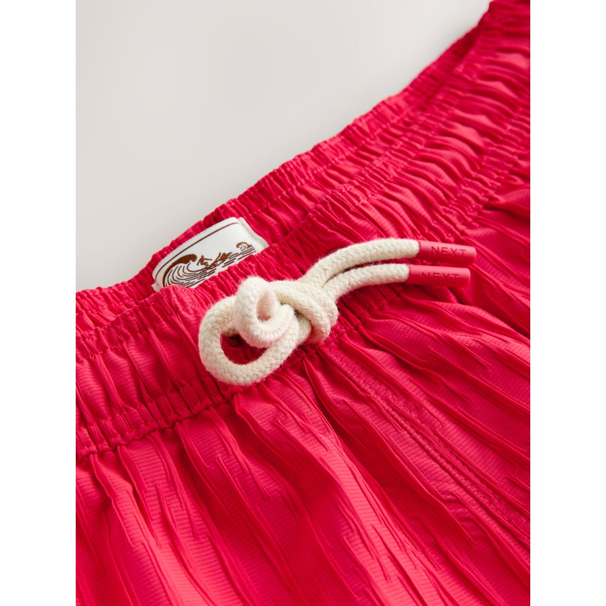 Short de bain texturé à rayures verticales rose corail, NEXT