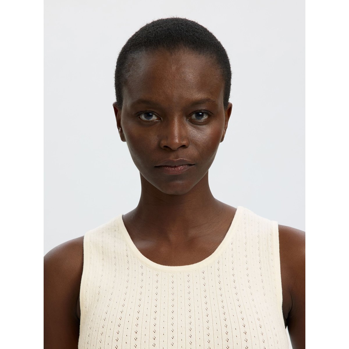 Top En Maille egret, SELECTED