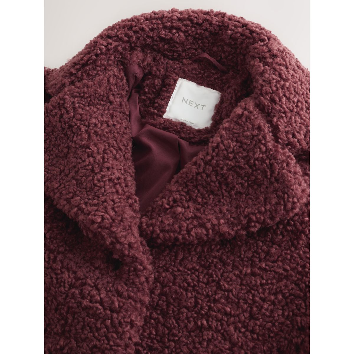 Manteau long en imitation peau de mouton rouge bordeaux, NEXT