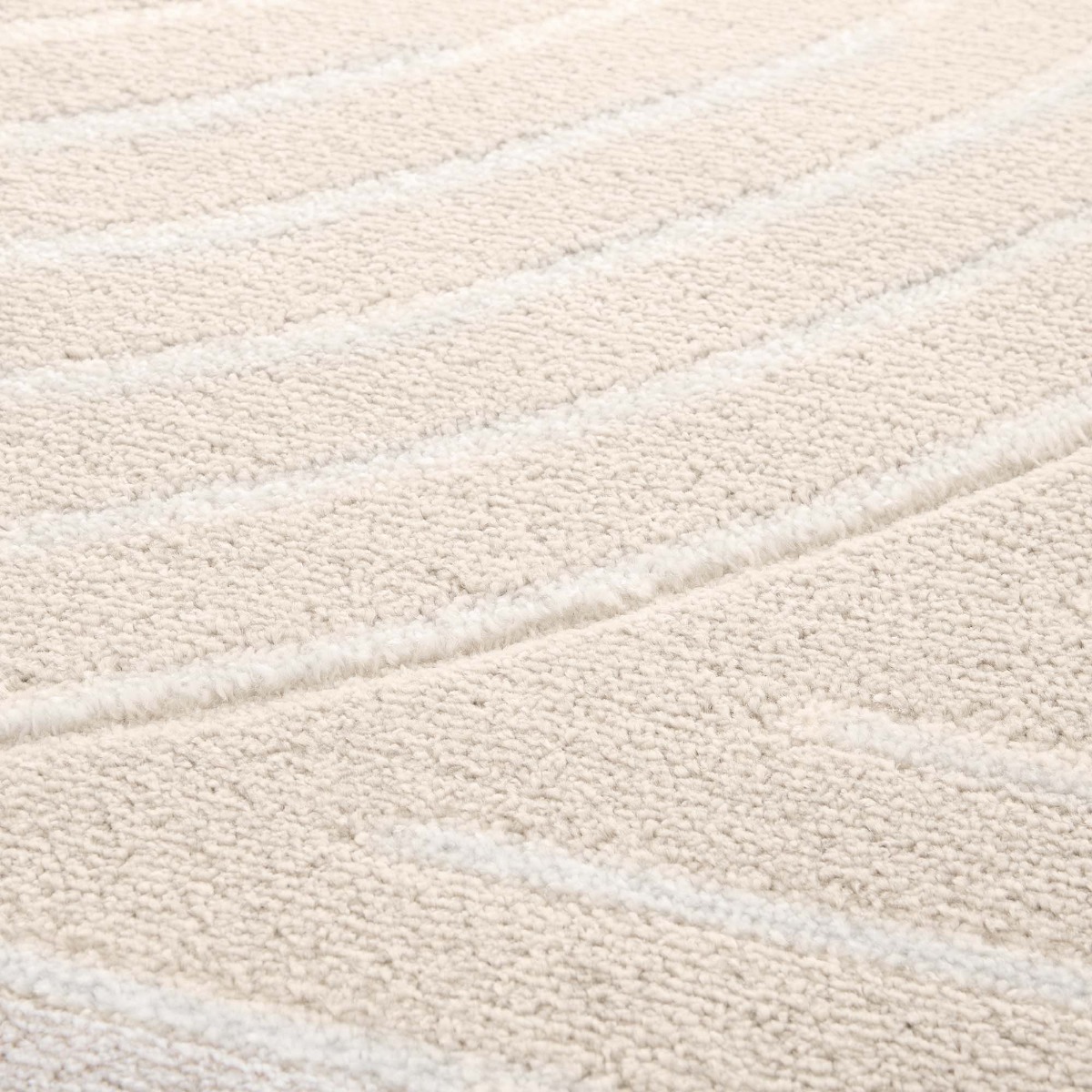 Tapis doux à relief abstrait géométrique  LUNE courbes blanches, THE DECO FACTORY