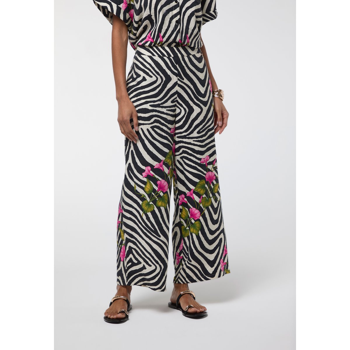 Pantalon palazzo imprimé zébra et fleurs à taille haute noir, LOLA CASADEMUNT