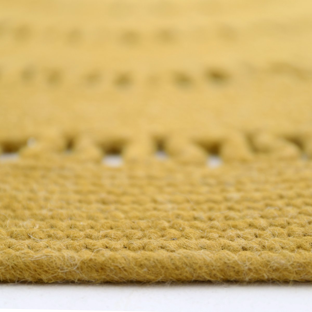 Tapis rond laine feutrée ajourée BIBEK mangue, NATTIOT