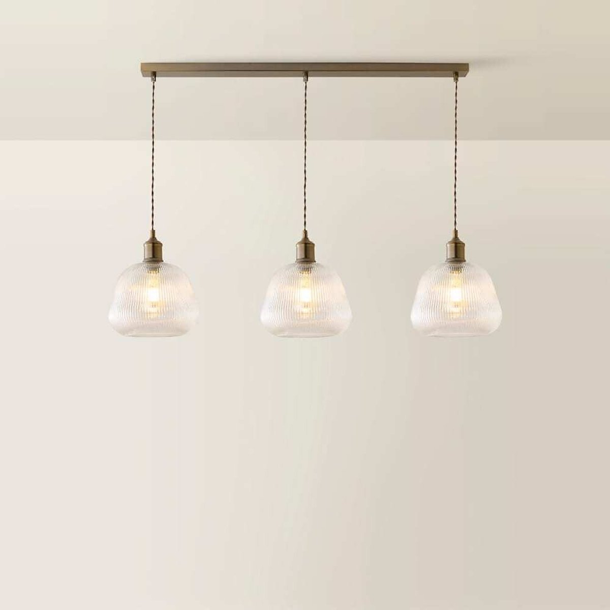 Delaney 3-Light Ribbed Bell Glass Diner Pendant Light with Filament Bulbs brushed brass, ÉDITÉ