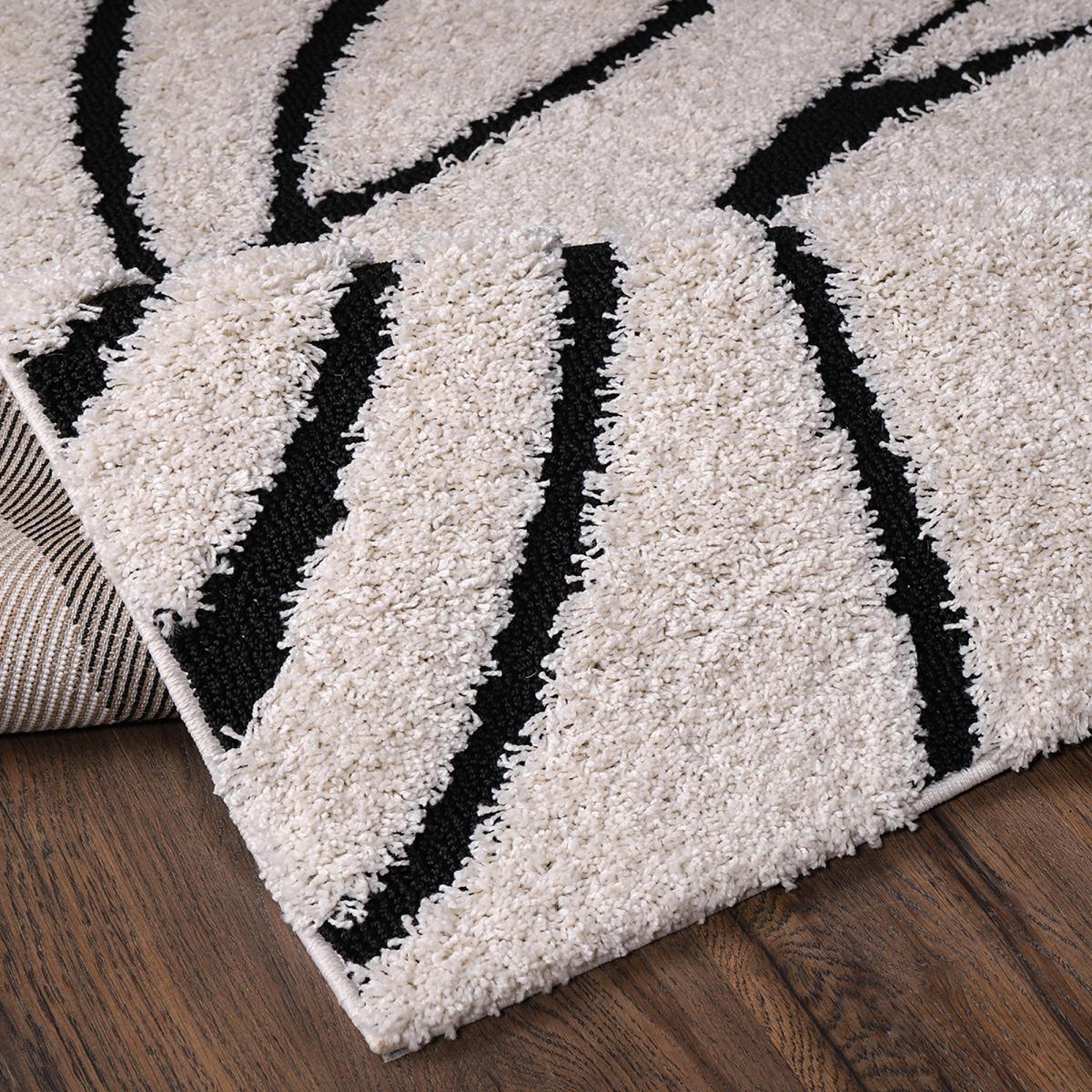 Tapis rond shaggy tissé motif géométrique POUDA crème, noir, UN AMOUR DE TAPIS