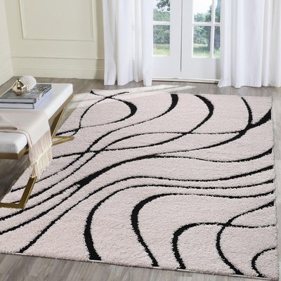 Tapis shaggy tissé motif géométrique POUDA UN AMOUR DE TAPIS