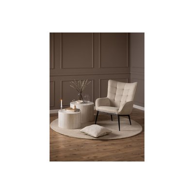 Fauteuil en tissu beige capitonné piétement oblique en métal noir - OTIS HELLIN, DEPUIS 1862