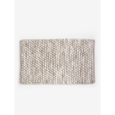 Tapis de bain à pompons NEXT