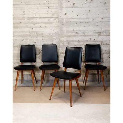 Lot de quatre chaises en bois et skaï Alma N°1640 - Bon état DEBONGOUT