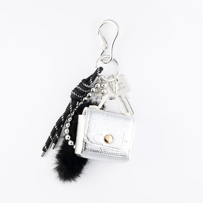 Bijoux de sac mini sac argenté et pompon noir BALABOOSTE