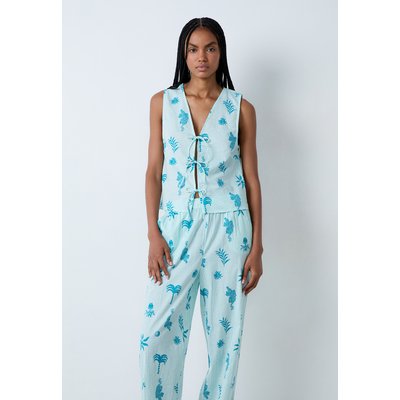 Top de pyjama en coton à motifs à nœuds devant EMMY ETAM