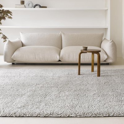 Tapis longs poils shaggy tissé en laine motif uni GRAVELA UN AMOUR DE TAPIS