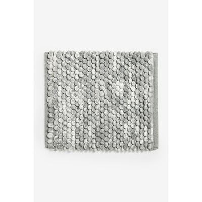 Tapis de bain à pompons NEXT
