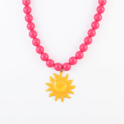 Collier de perles rose fuchsia pendentif soleil BALABOOSTE