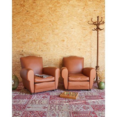Paire de fauteuils club en cuir Ernest N°963 - Bon état DEBONGOUT