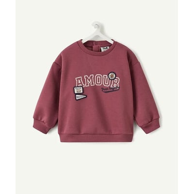 Sweat col rond en molleton, avec message et badges brodés, fermeture au dos TAPE A L'OEIL