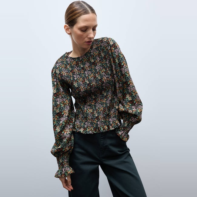 Top manches longues imprimé noir <span itemprop=