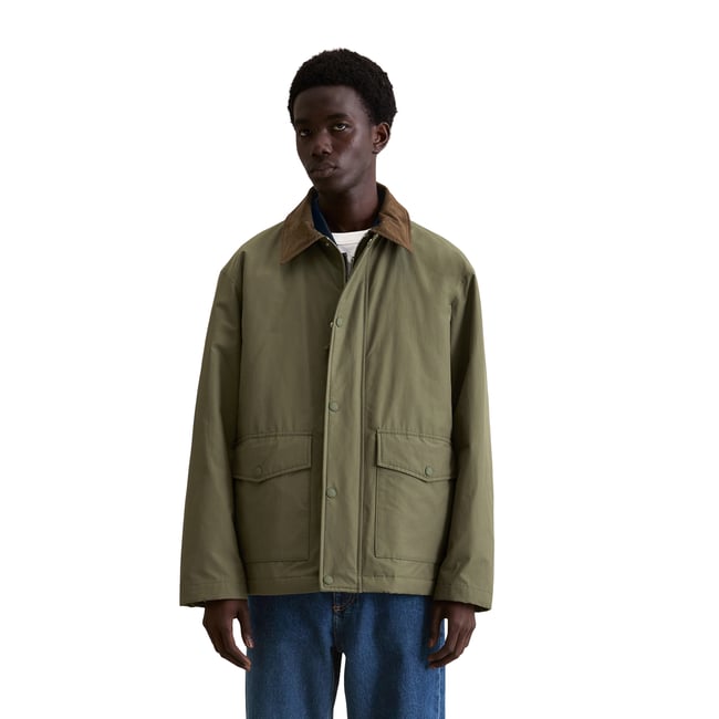 Barnjacket regular imperméable et légèrement matelassé vert foncé <span itemprop=