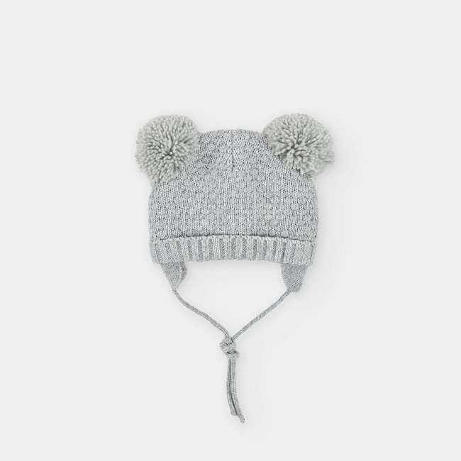 Bonnet bébé avec pompons gris <span itemprop=