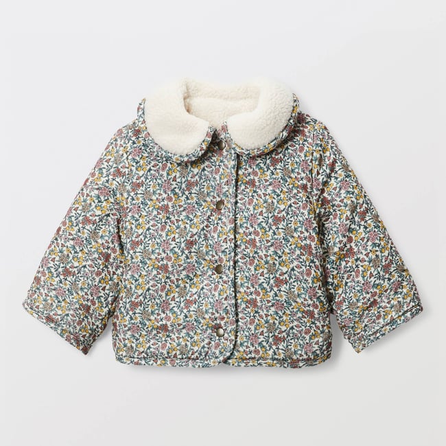 Veste réversible en moumoute et en velours imprimée naturel <span itemprop=