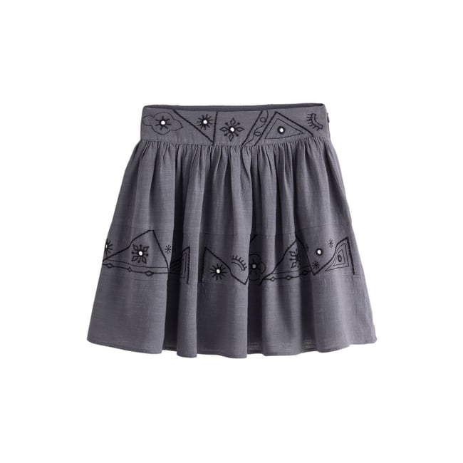 Mini-jupe à volants avec broderie miroir bleu acier délavé <span itemprop=