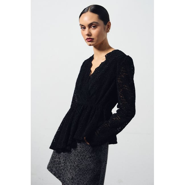 Top asymétrique en velours, brodé noir <span itemprop=