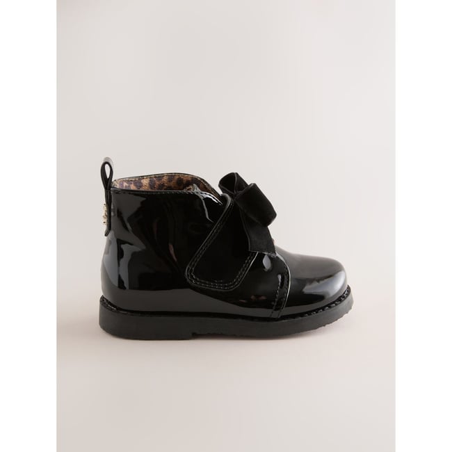Bottines à nœud noir <span itemprop=