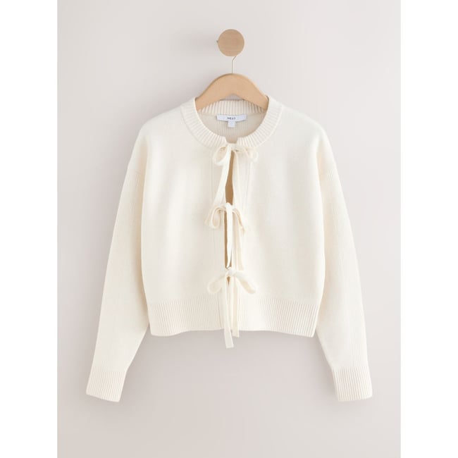 Cardigan en maille douce noué sur le devant écru <span itemprop=