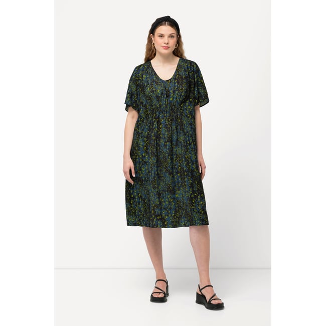 Robe midi à pois. Décolleté en V noir <span itemprop=