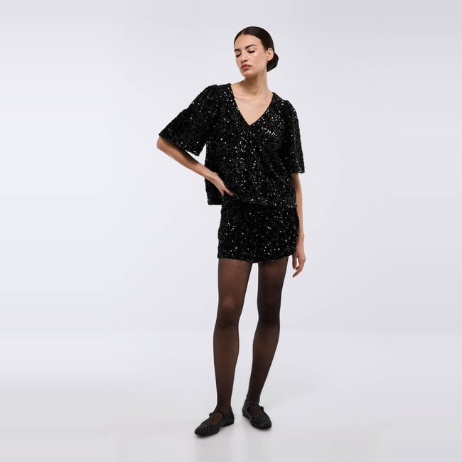 Short à sequins noir <span itemprop=